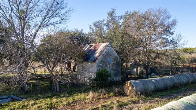 a backyard of a house with lots of green space