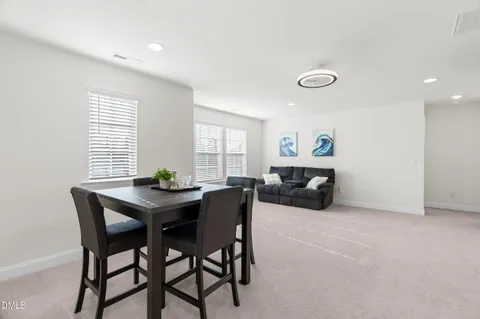 a living room with furniture and a table