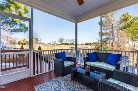 a roof deck with outdoor seating