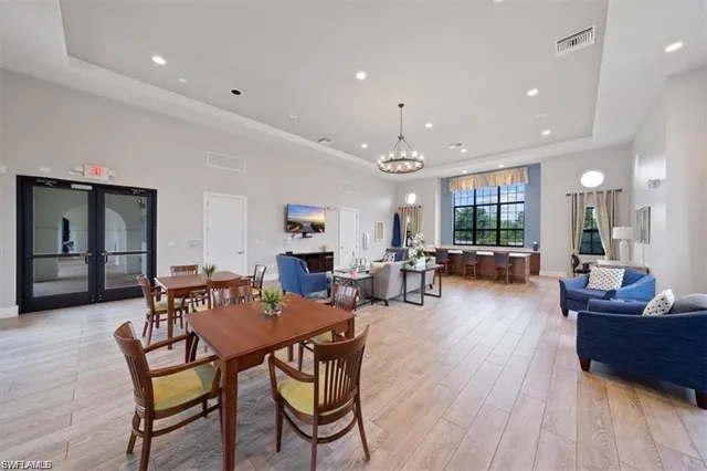 a living room with lots of furniture and gym equipment