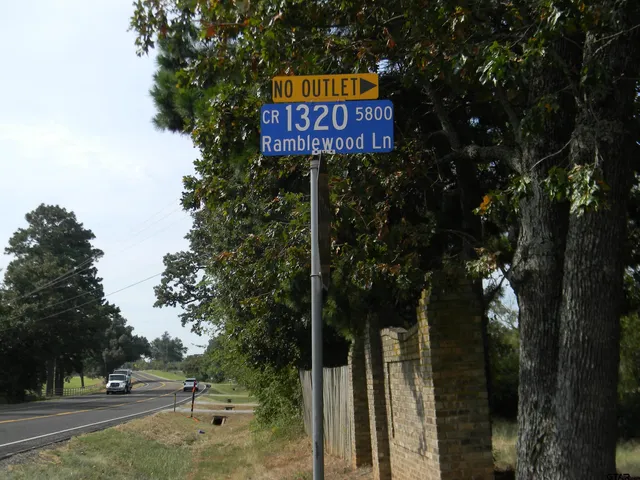 a sign that is on the side of a road