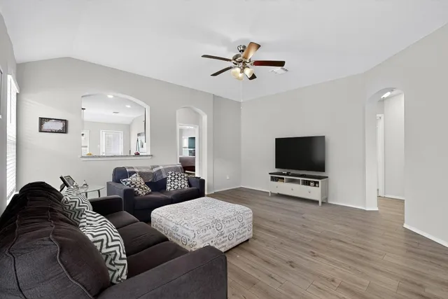 a living room with furniture and a flat screen tv