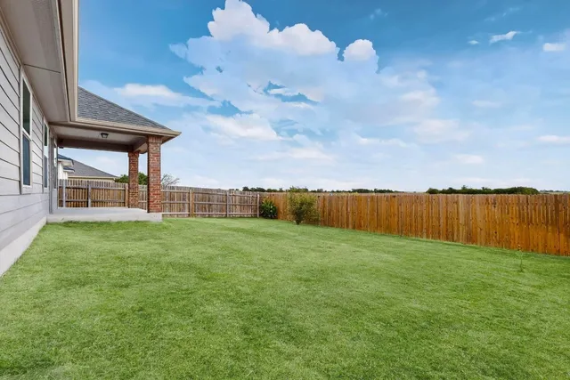 a view of a backyard with garden