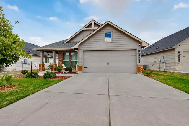 a front view of house with yard and green space