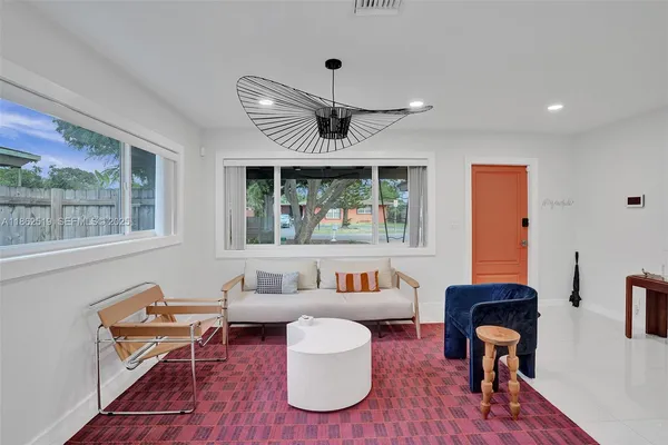 a living room with furniture and a window