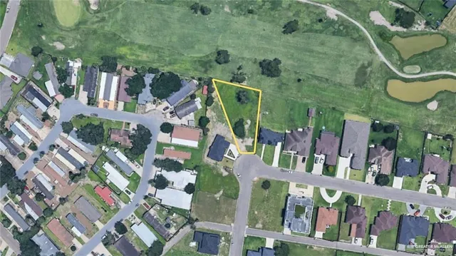 an aerial view of residential house with outdoor space and parking