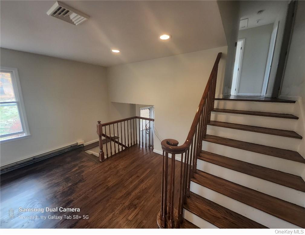 230 Prospect Road Monroe, NY 10950 - Photo 5 of 13 Stairs with a baseboard radiator, recessed lighting, and wood finished floors
