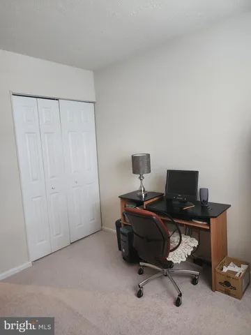 a view of a workspace with furniture