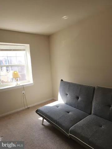 a bed room with furniture and a window