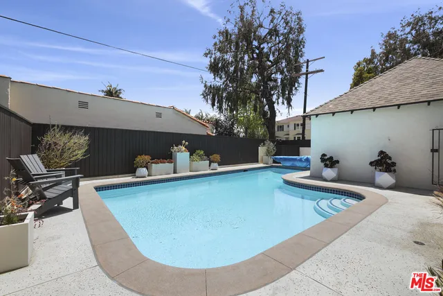 a view of a swimming pool with lounge chair