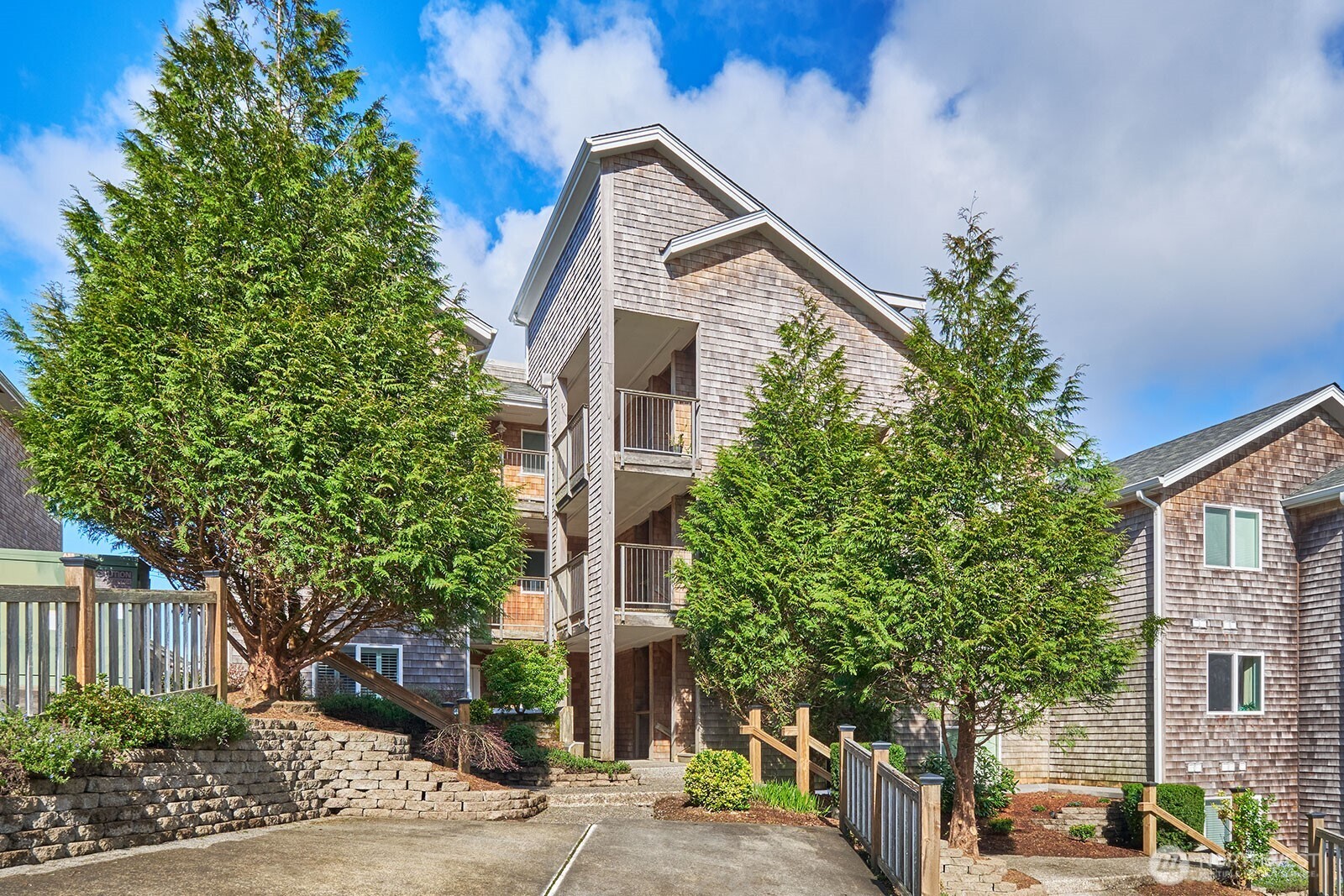 2815 Willows Road, Unit 229 Seaview, WA 98644 - Photo 18 of 25 a front view of a house with trees