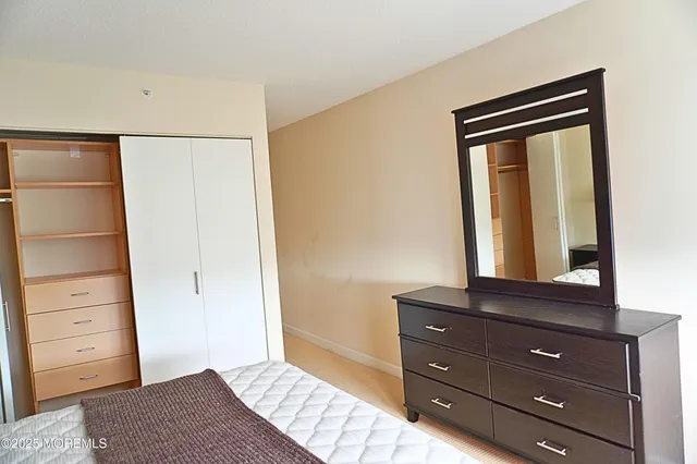 a room with a dresser and a mirror