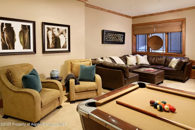 a bedroom with bed and a couch