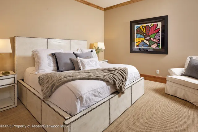 a bathroom with a granite countertop sink a toilet a mirror and shower