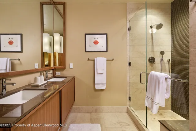 a bedroom with a bed and a television