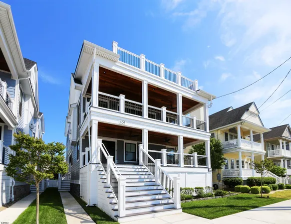 a front view of a building with a yard
