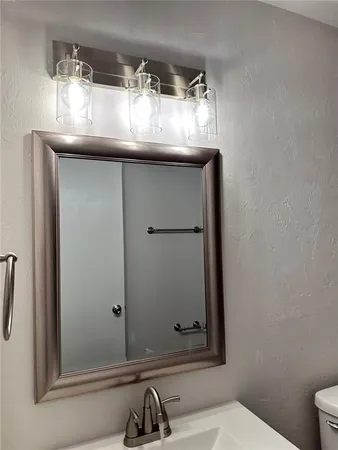 a bathroom with a sink and mirror
