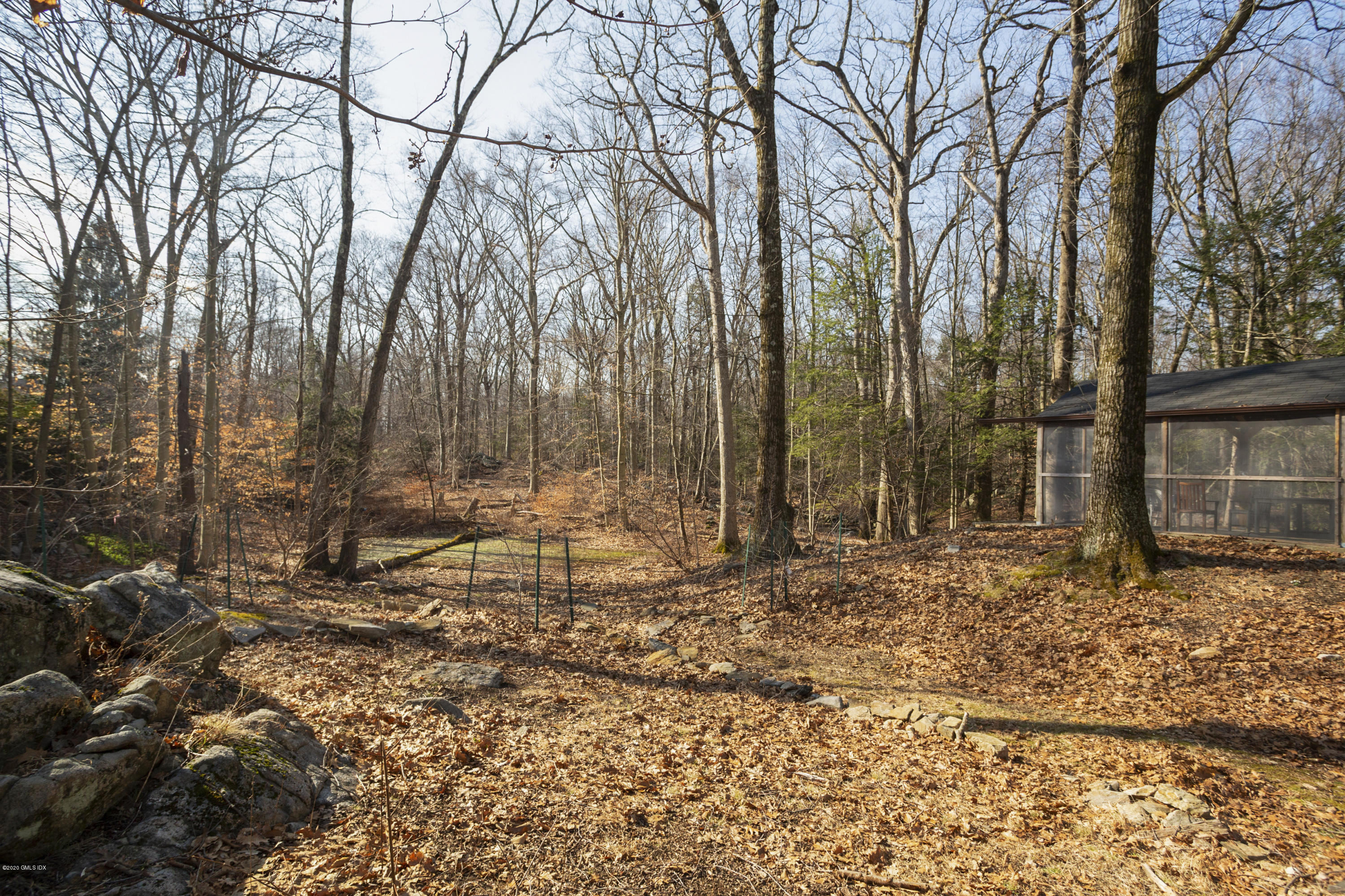 450 Riversville Road Greenwich, CT 06831 - Photo 14 of 14 a view of a yard with snow in the background