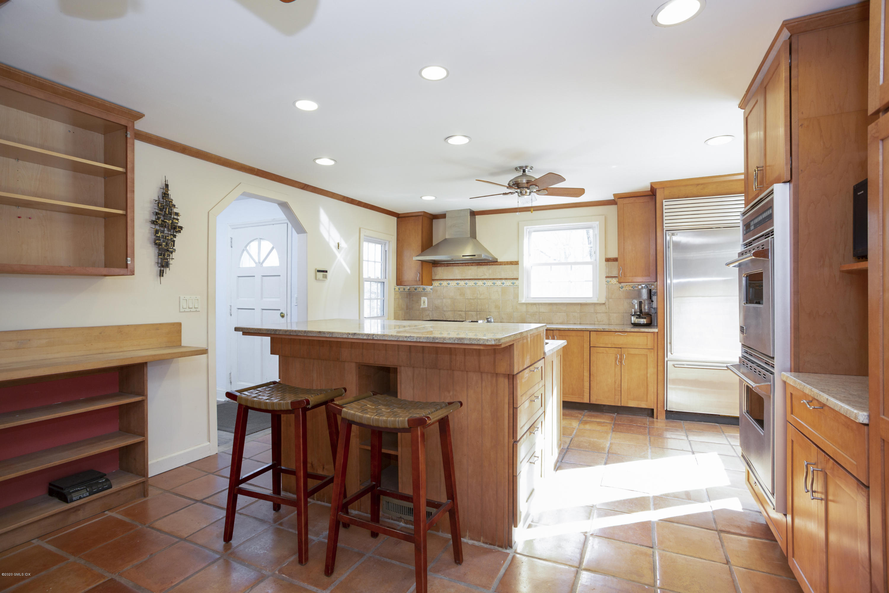 450 Riversville Road Greenwich, CT 06831 - Photo 4 of 14 a kitchen with stainless steel appliances kitchen island granite countertop a sink and cabinets
