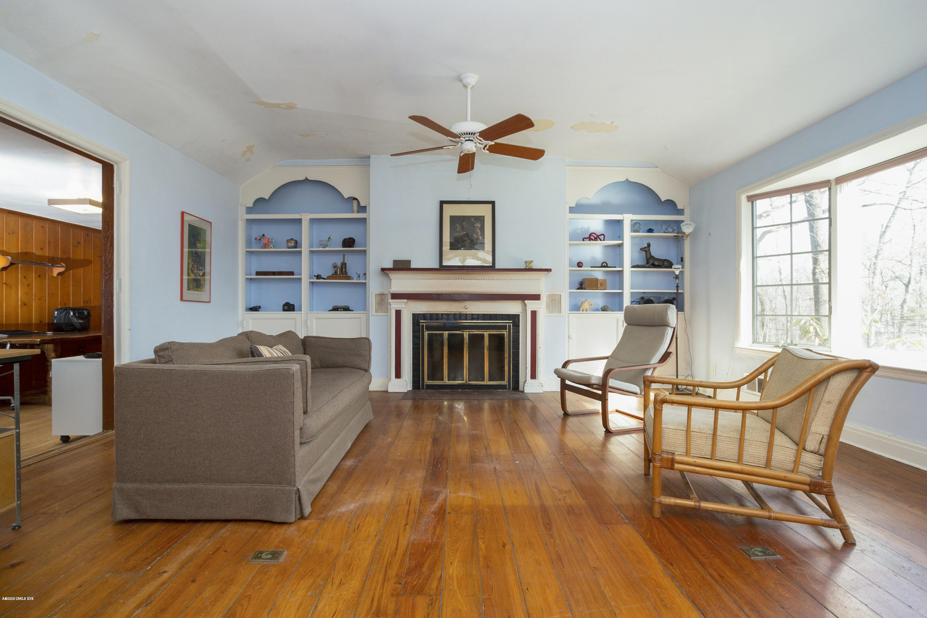 450 Riversville Road Greenwich, CT 06831 - Photo 7 of 14 a living room with furniture and a fireplace