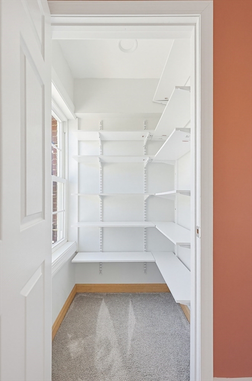 44 Clark Street Spencer, MA 01562 - Photo 21 of 41 a view of walk in closet with empty racks