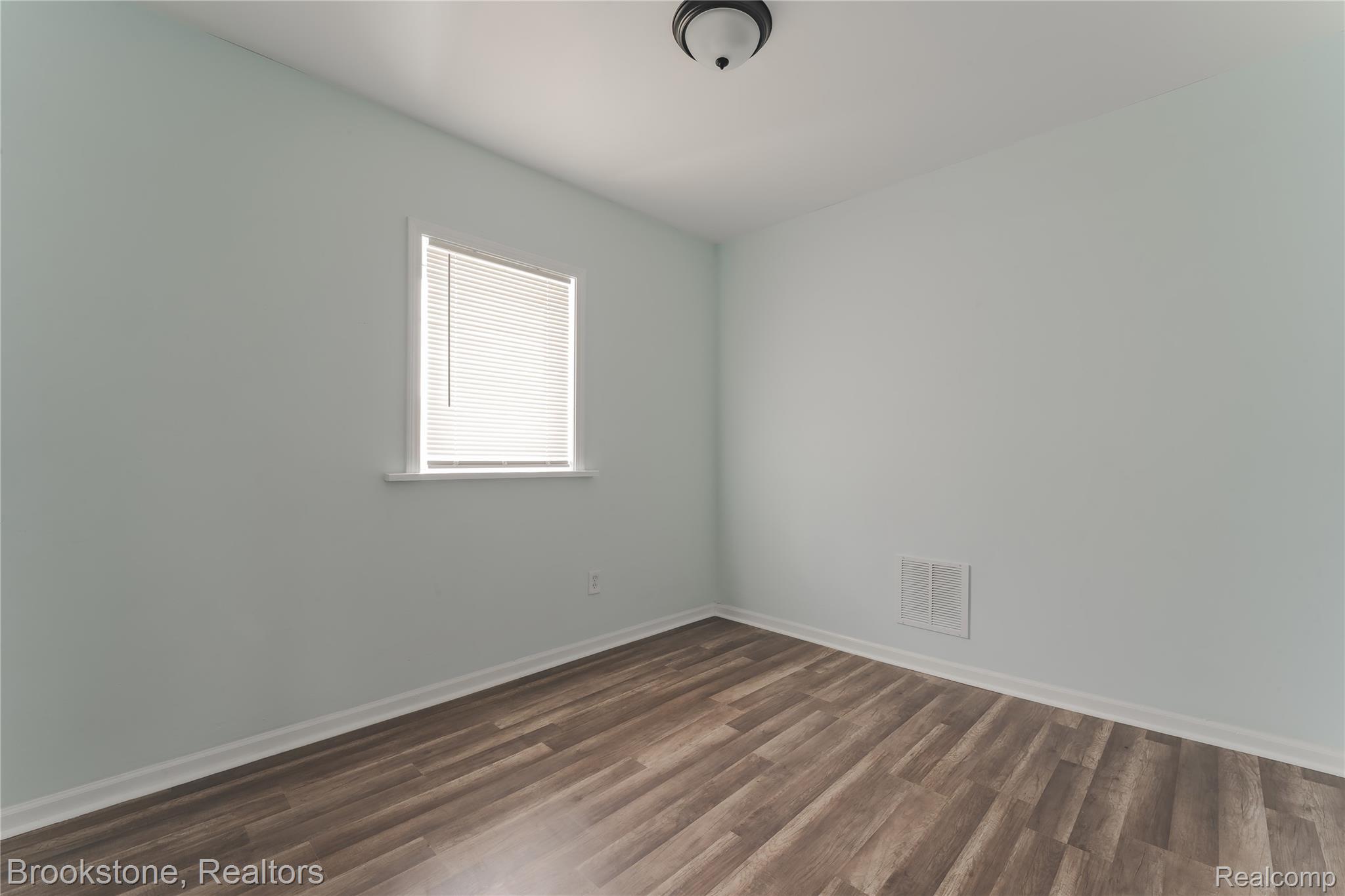 202 West Rundell Street Pontiac, MI 48342 - Photo 20 of 27 Secondary Bedroom with baseboards and dark wood finished floors