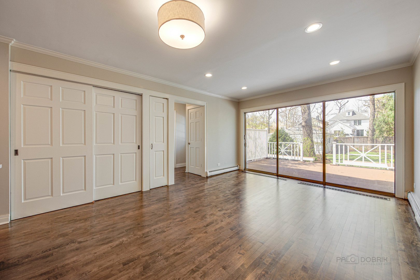 1417 Tower Road Winnetka, IL 60093 - Photo 12 of 39 a view of an empty room with wooden floor and a window
