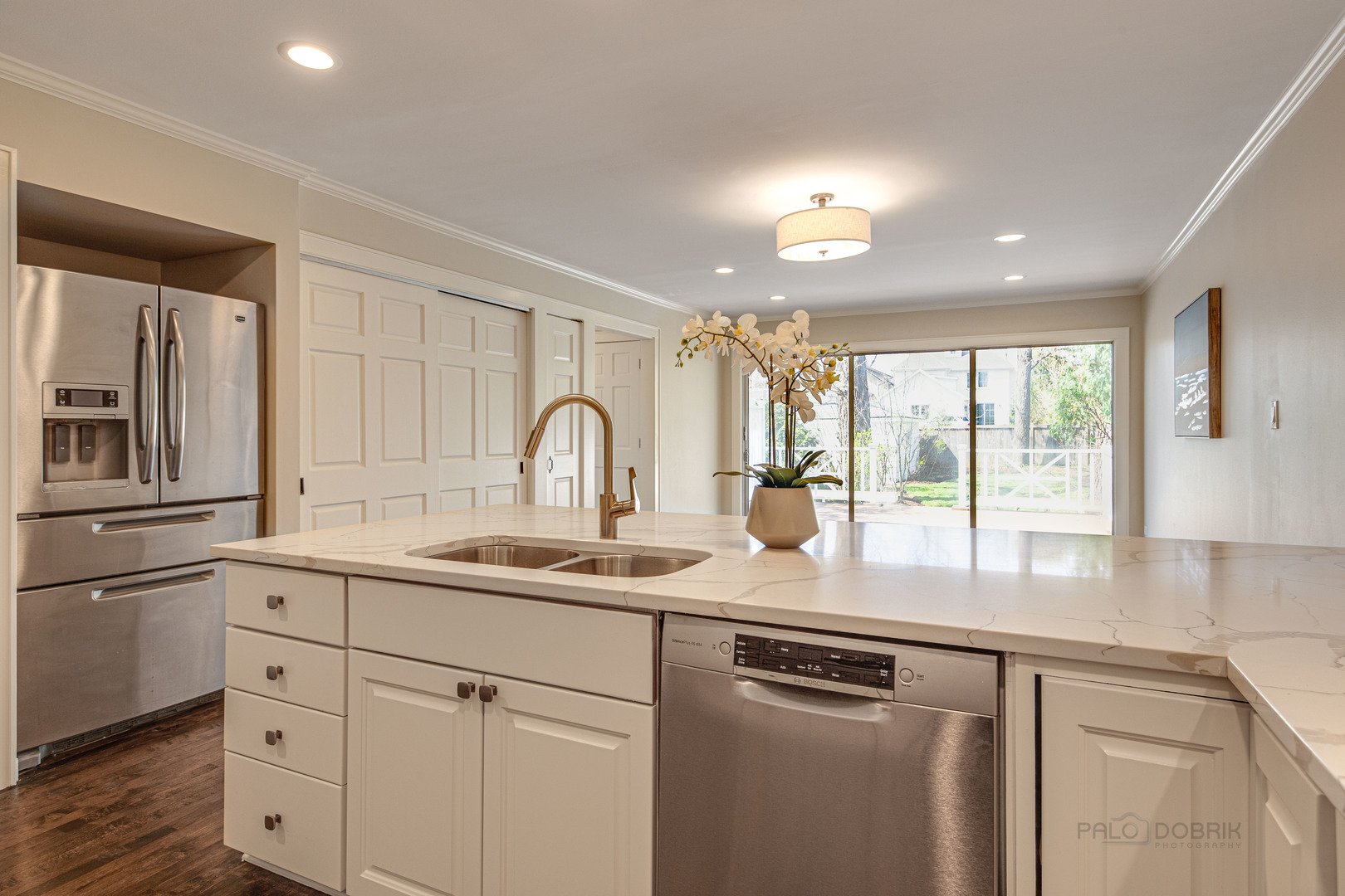 1417 Tower Road Winnetka, IL 60093 - Photo 16 of 39 a kitchen with stainless steel appliances granite countertop a sink a stove and cabinets
