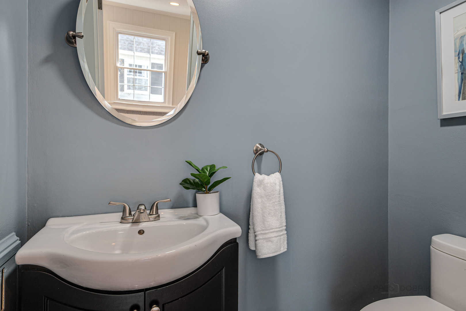 1417 Tower Road Winnetka, IL 60093 - Photo 17 of 39 a bathroom with a sink toilet and mirror