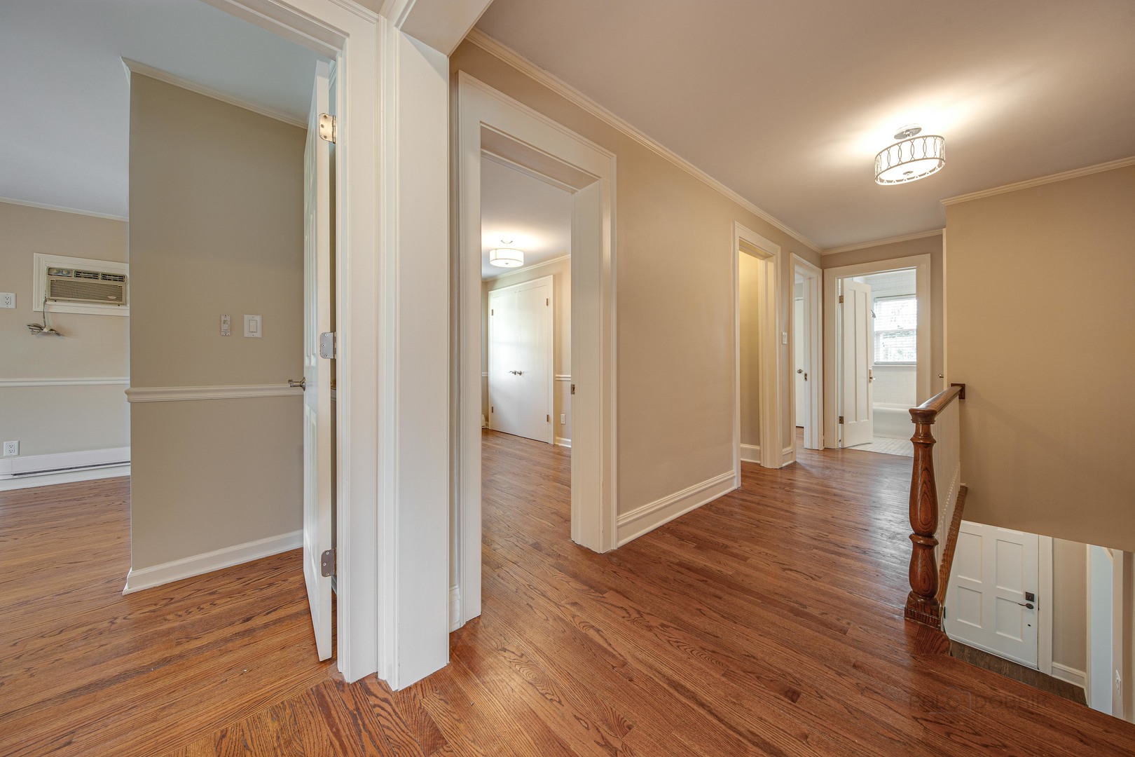 1417 Tower Road Winnetka, IL 60093 - Photo 18 of 39 a view of a hallway with wooden floor