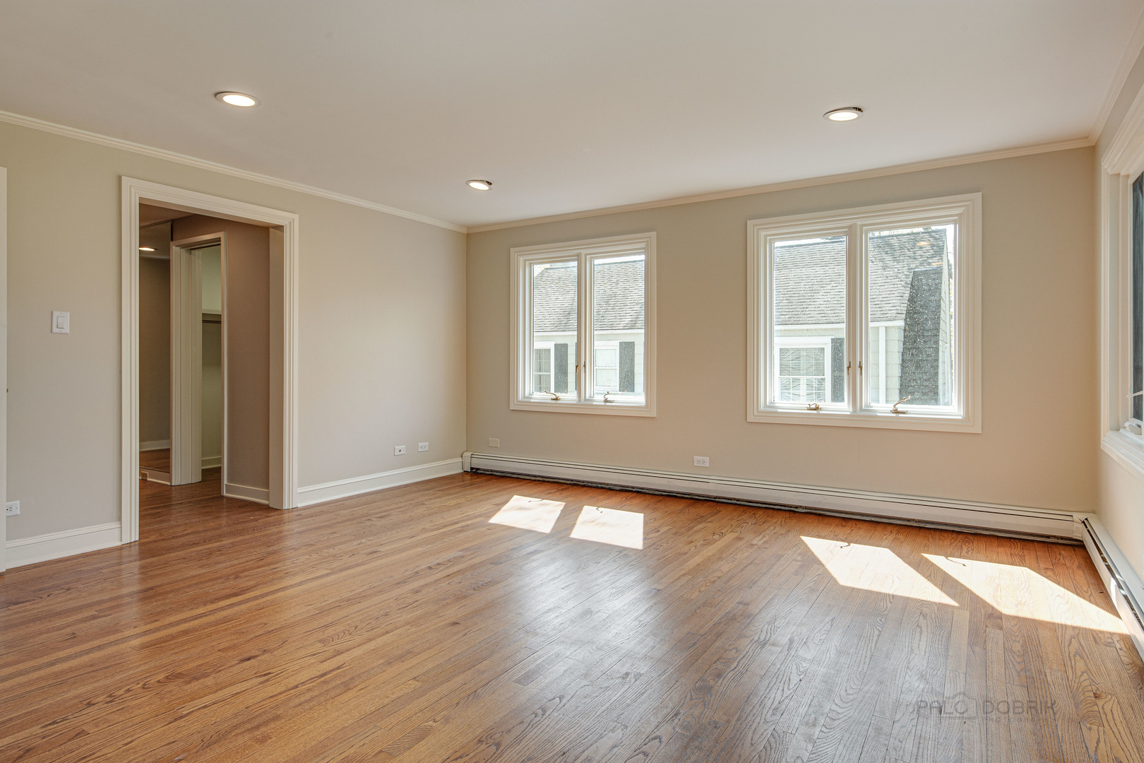 1417 Tower Road Winnetka, IL 60093 - Photo 20 of 39 a view of an empty room with wooden floor and a window