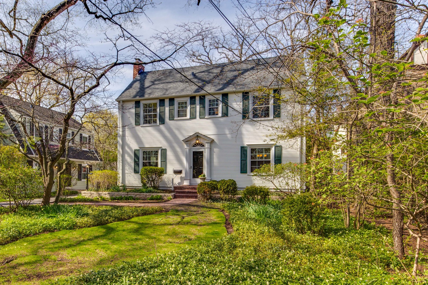 1417 Tower Road Winnetka, IL 60093 - Photo 2 of 39 a front view of a house with swimming pool