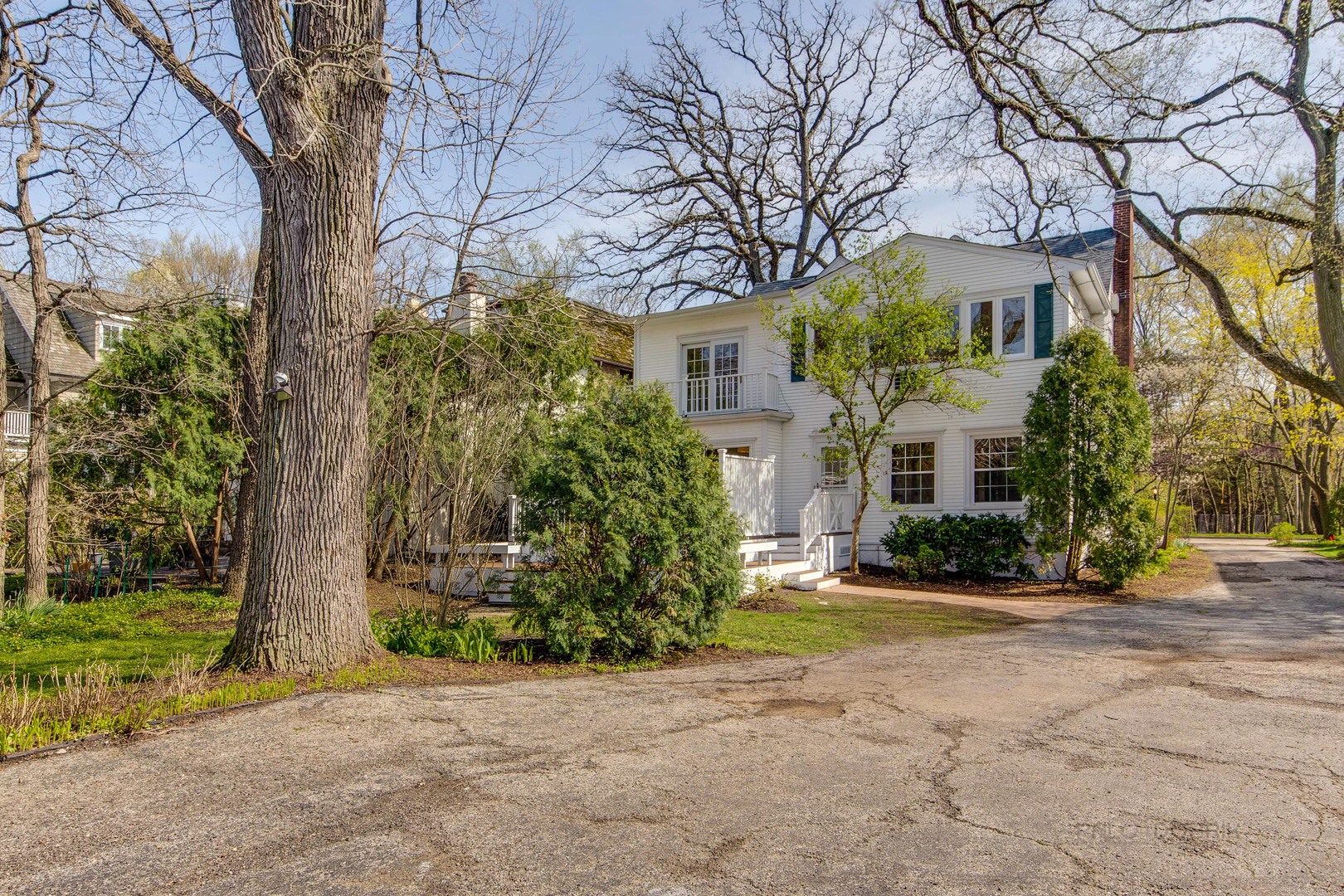 1417 Tower Road Winnetka, IL 60093 - Photo 35 of 39 a front view of a house with garden