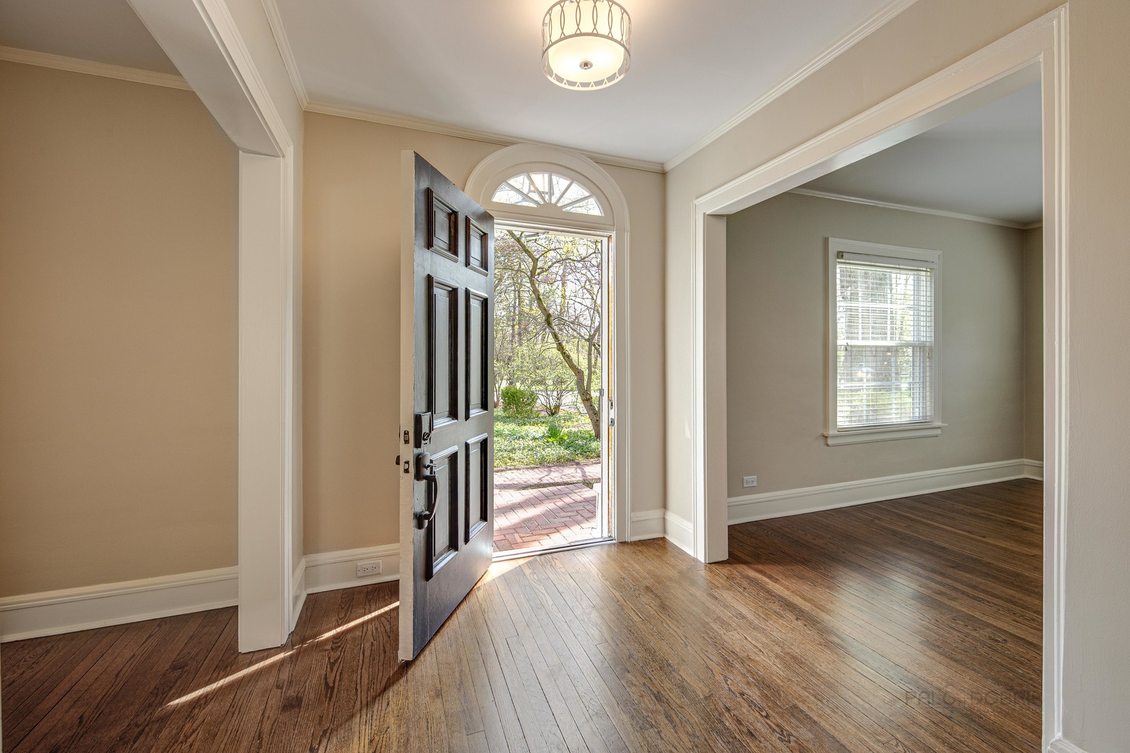 1417 Tower Road Winnetka, IL 60093 - Photo 4 of 39 wooden floor in an empty room with a window