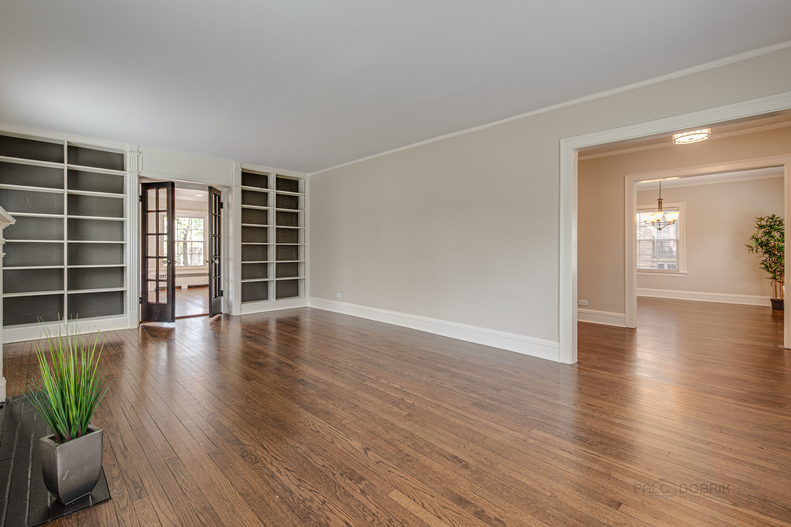 1417 Tower Road Winnetka, IL 60093 - Photo 7 of 39 a view of an empty room with wooden floor and a window