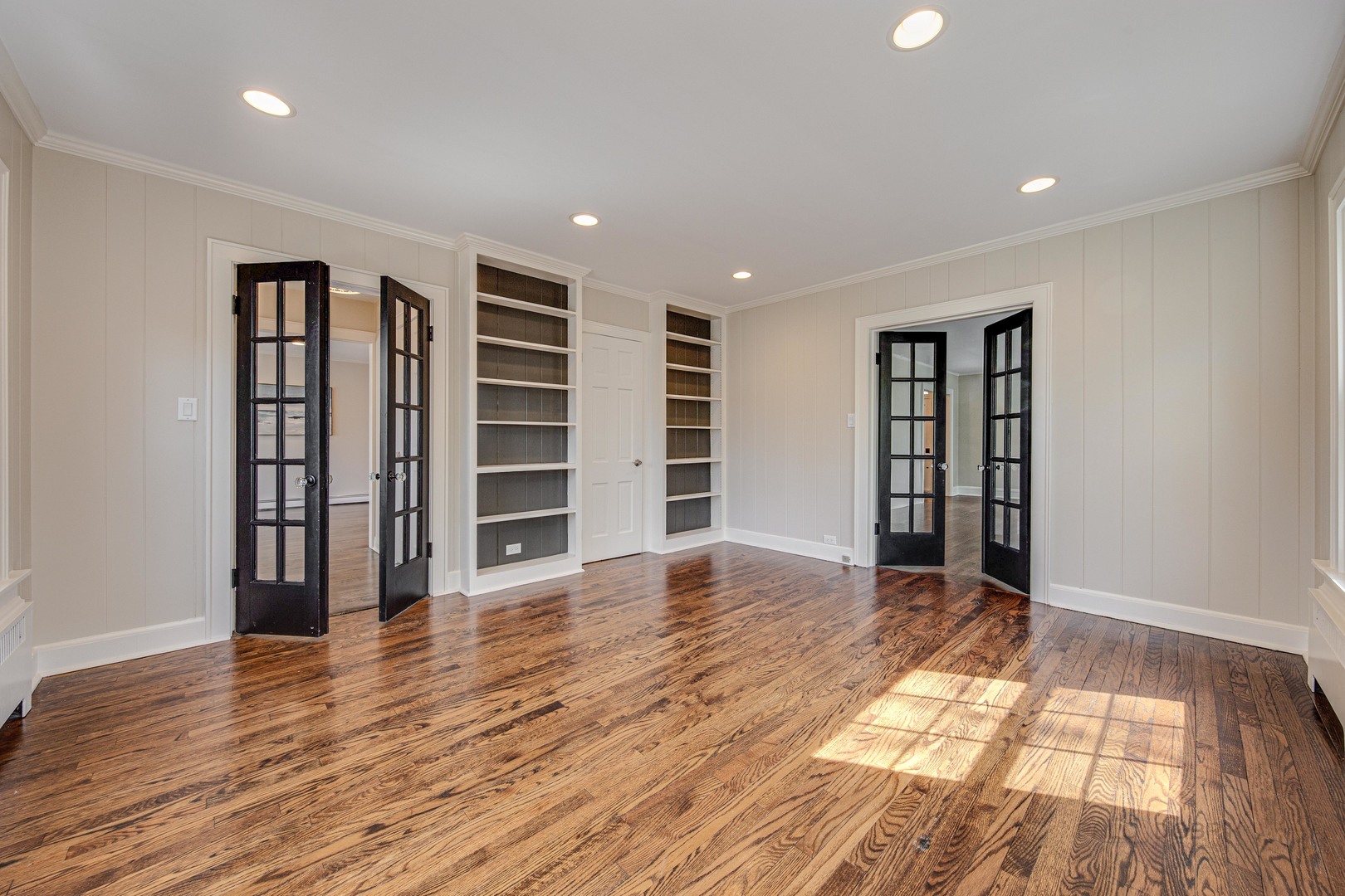 1417 Tower Road Winnetka, IL 60093 - Photo 9 of 39 wooden floor in an empty room with a window