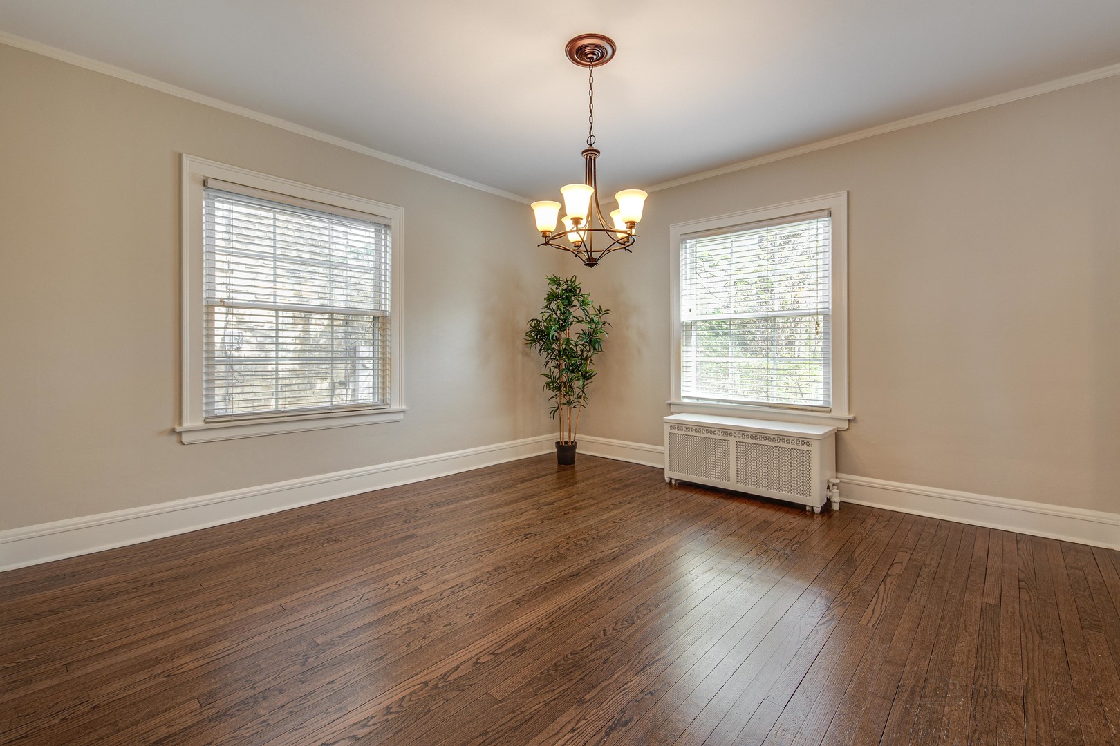 1417 Tower Road Winnetka, IL 60093 - Photo 10 of 39 a view of an empty room with wooden floor and a window