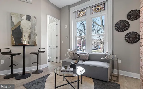 a living room with furniture and a window