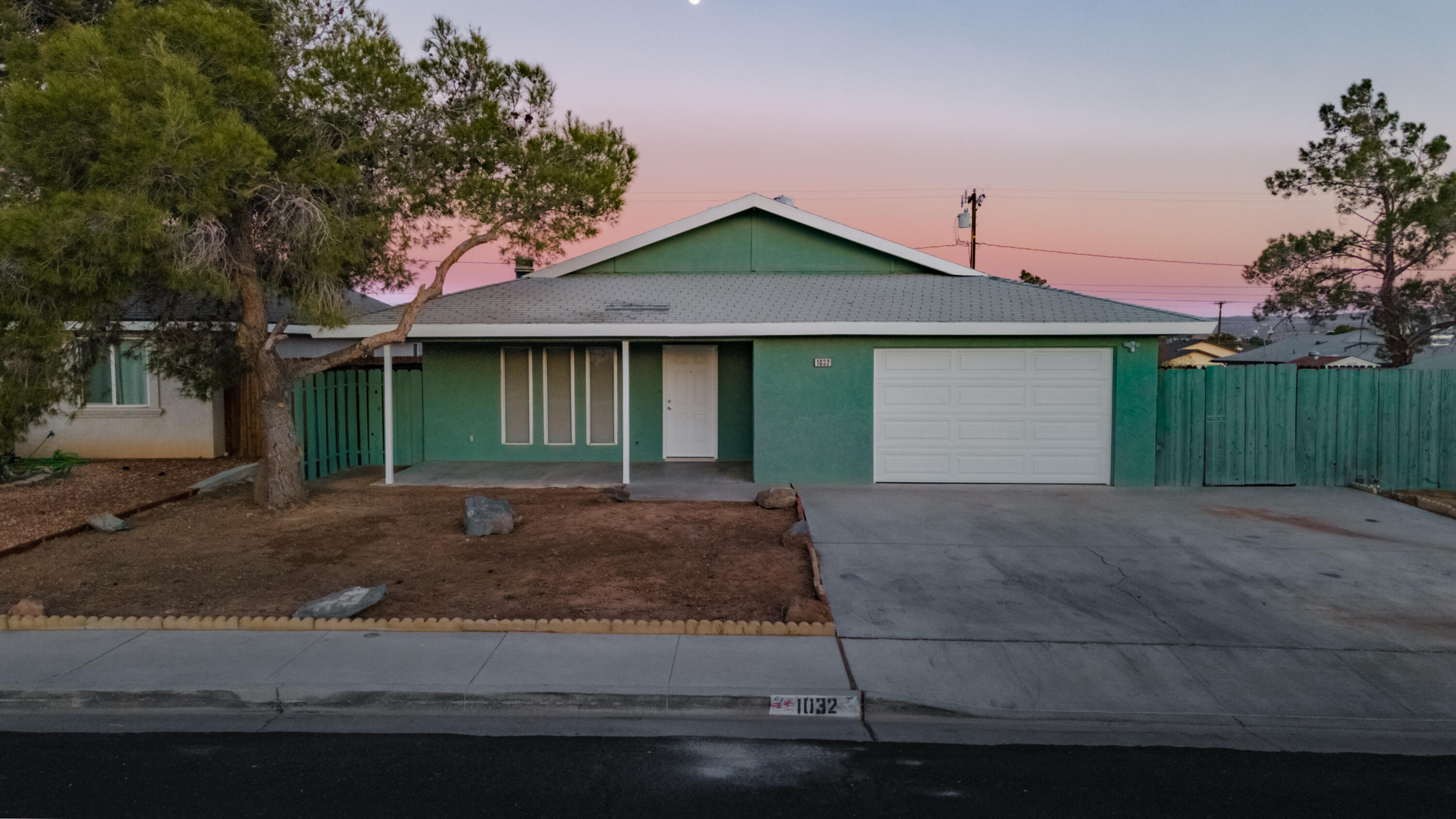 1032 South Farragut Street Ridgecrest, CA 93555 - Photo 19 of 32 a front view of a house with garage