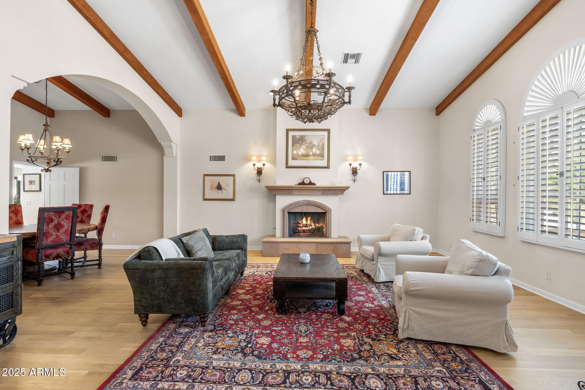 4520 East Horseshoe Road Phoenix, AZ 85028 - Photo 14 of 50 a living room with furniture a chandelier and a rug