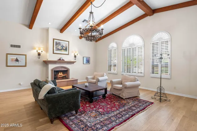 a view of a dining room with furniture wooden floor and chandelier