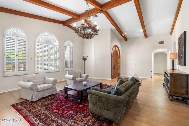 a view of a dining room with furniture wooden floor and chandelier