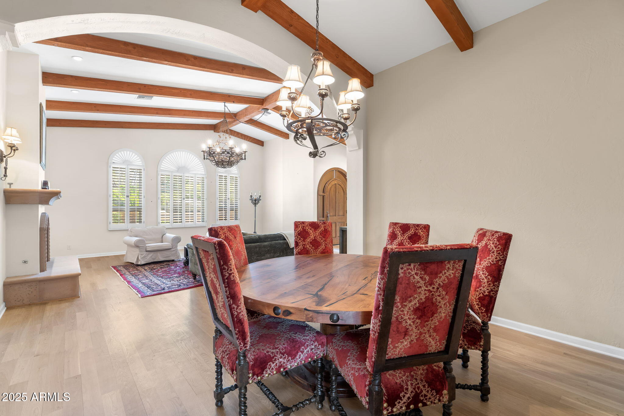 4520 East Horseshoe Road Phoenix, AZ 85028 - Photo 18 of 50 a view of a dining room with furniture wooden floor and chandelier