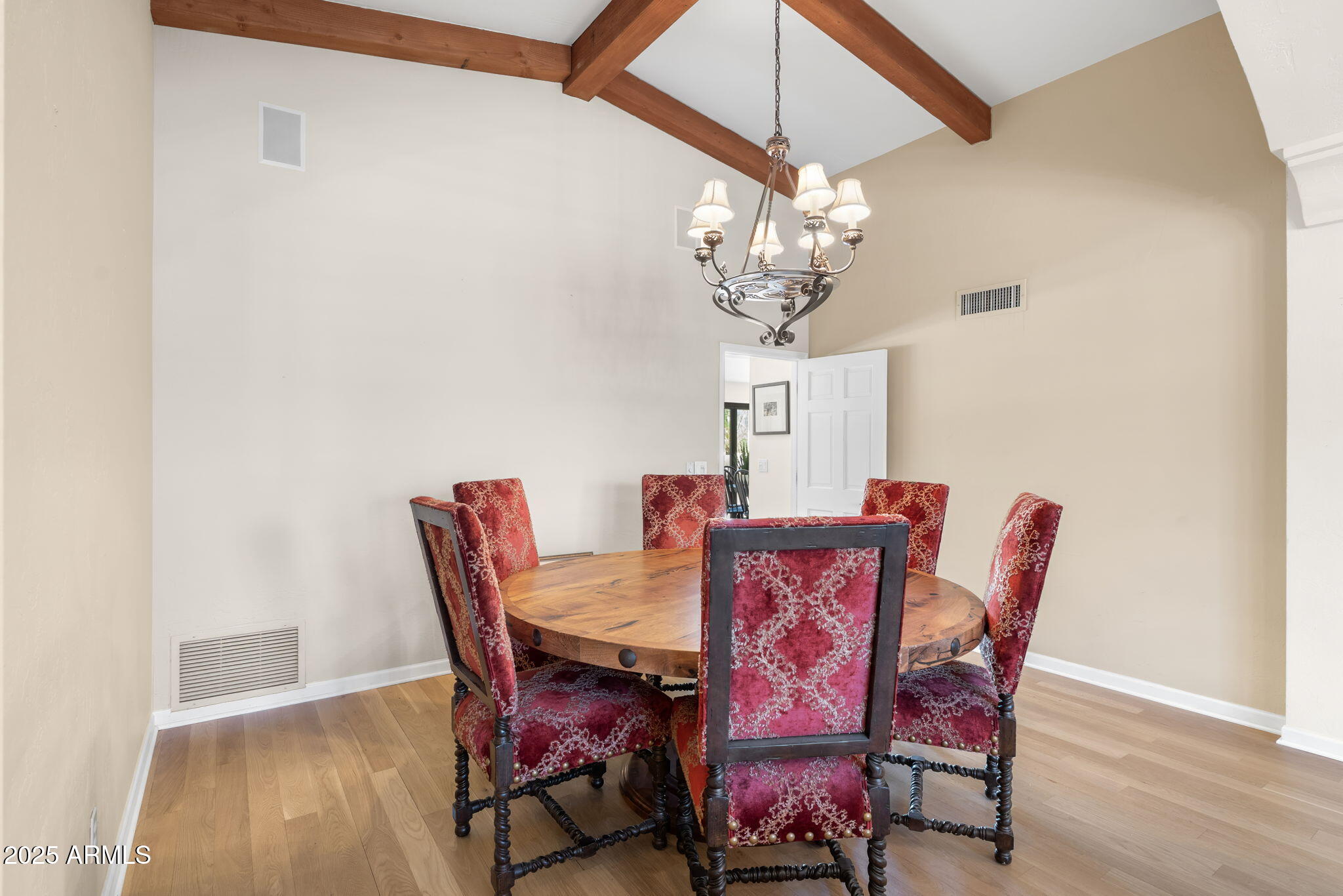 4520 East Horseshoe Road Phoenix, AZ 85028 - Photo 19 of 50 a view of a dining room with furniture wooden floor and chandelier