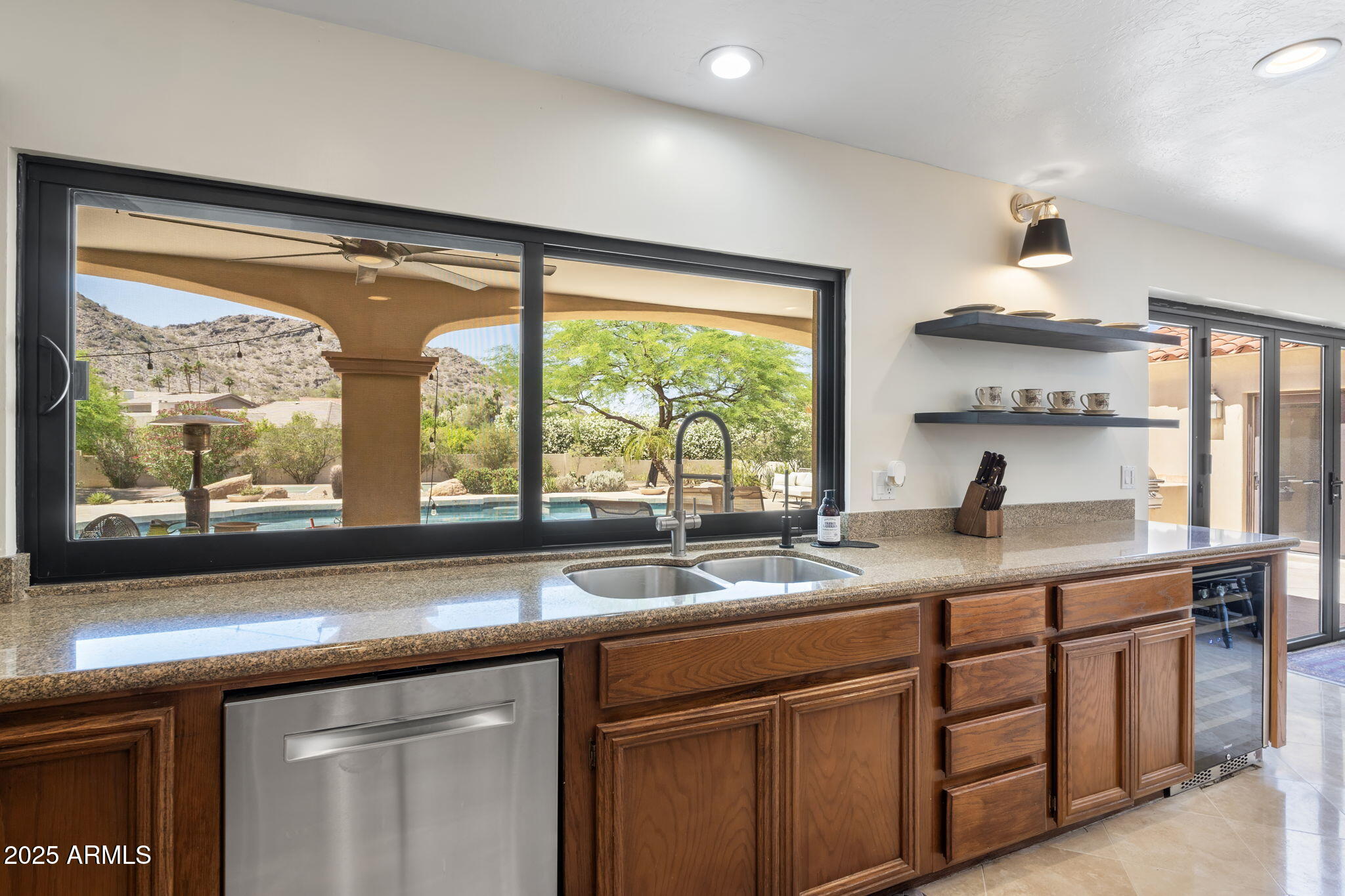 4520 East Horseshoe Road Phoenix, AZ 85028 - Photo 21 of 50 a kitchen with a sink and a large window