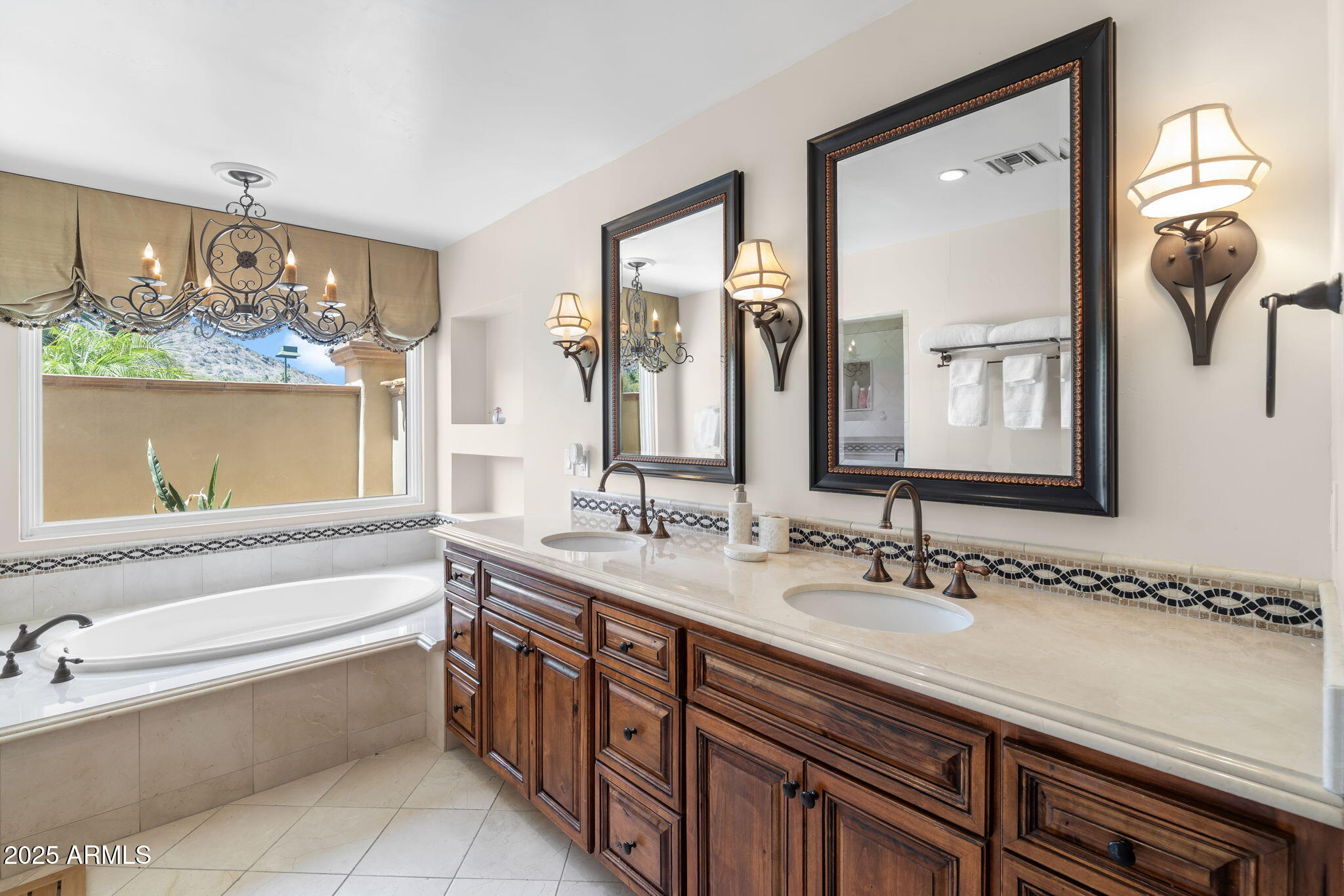 4520 East Horseshoe Road Phoenix, AZ 85028 - Photo 22 of 50 a bath room with a sink and a mirror
