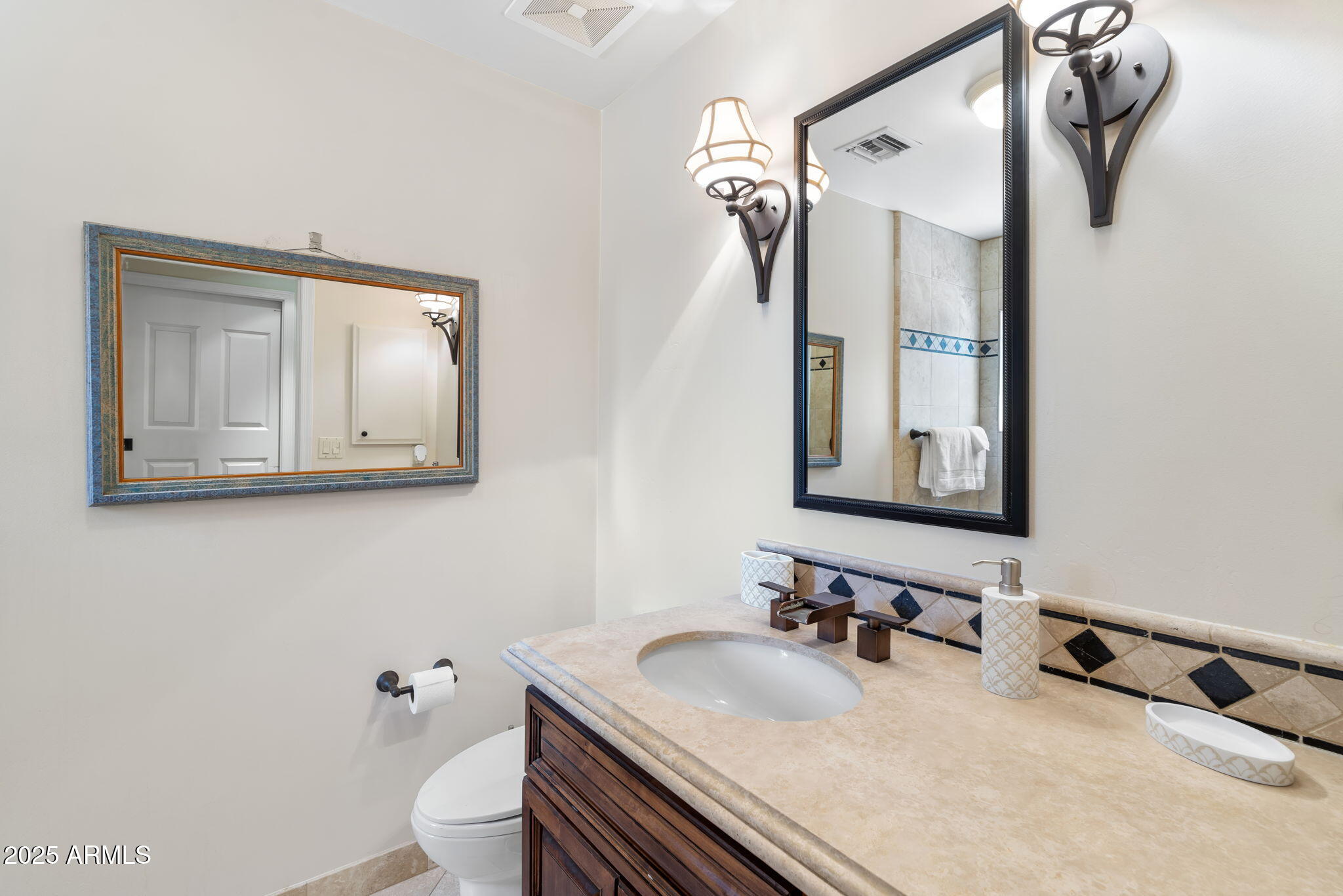 4520 East Horseshoe Road Phoenix, AZ 85028 - Photo 24 of 50 a bathroom with a sink and a mirror