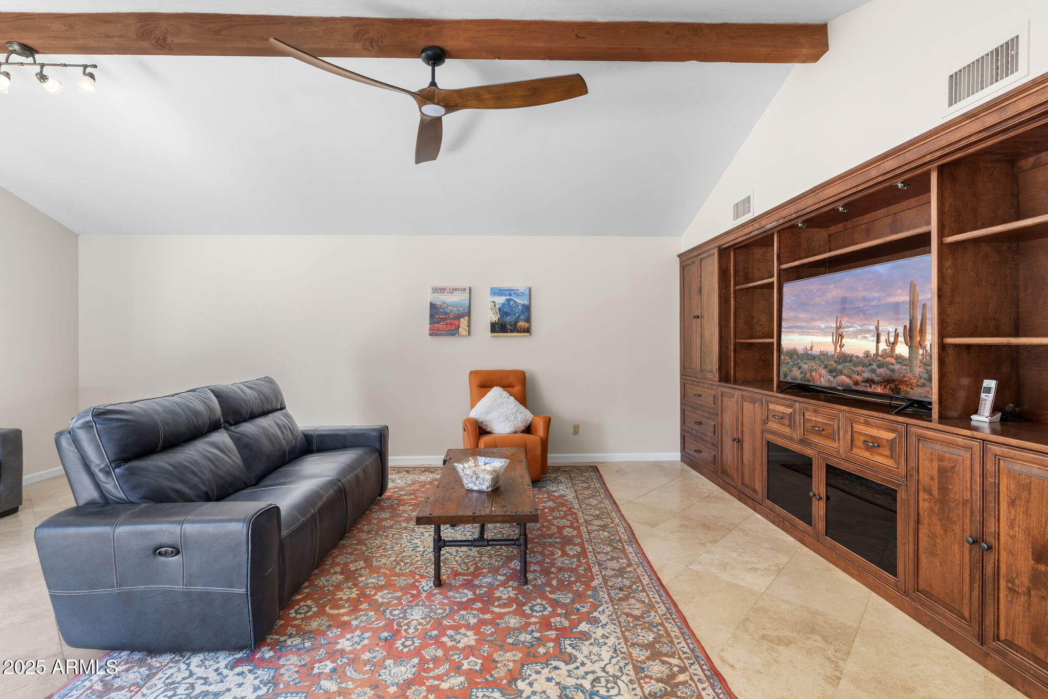 4520 East Horseshoe Road Phoenix, AZ 85028 - Photo 27 of 50 a living room with furniture and a flat screen tv