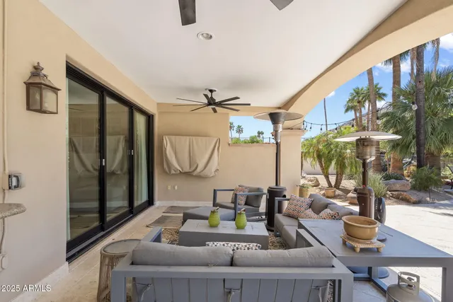 a view of a house with backyard porch and sitting area