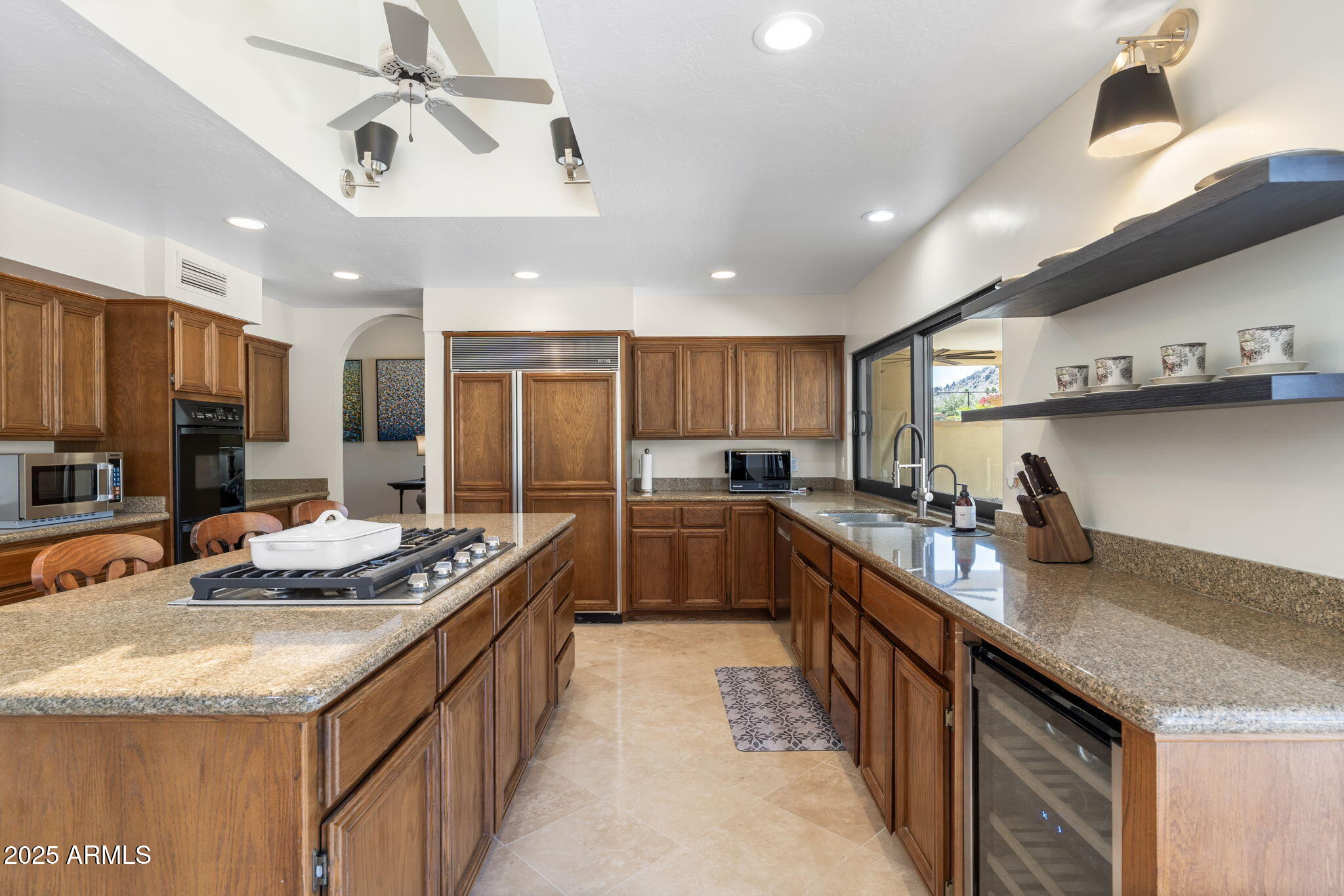 4520 East Horseshoe Road Phoenix, AZ 85028 - Photo 32 of 50 a kitchen with stainless steel appliances granite countertop a sink a stove and a refrigerator